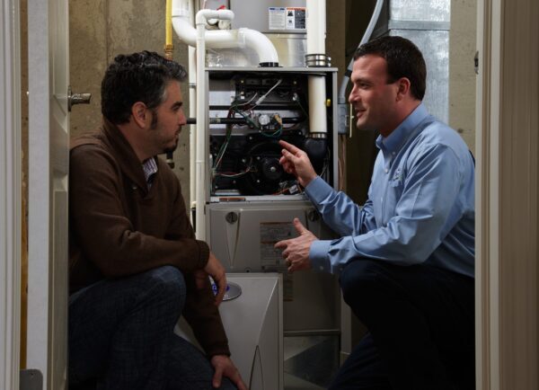 HVAC Technician With Customer Discussing Furnace Repair in Louisville, KY